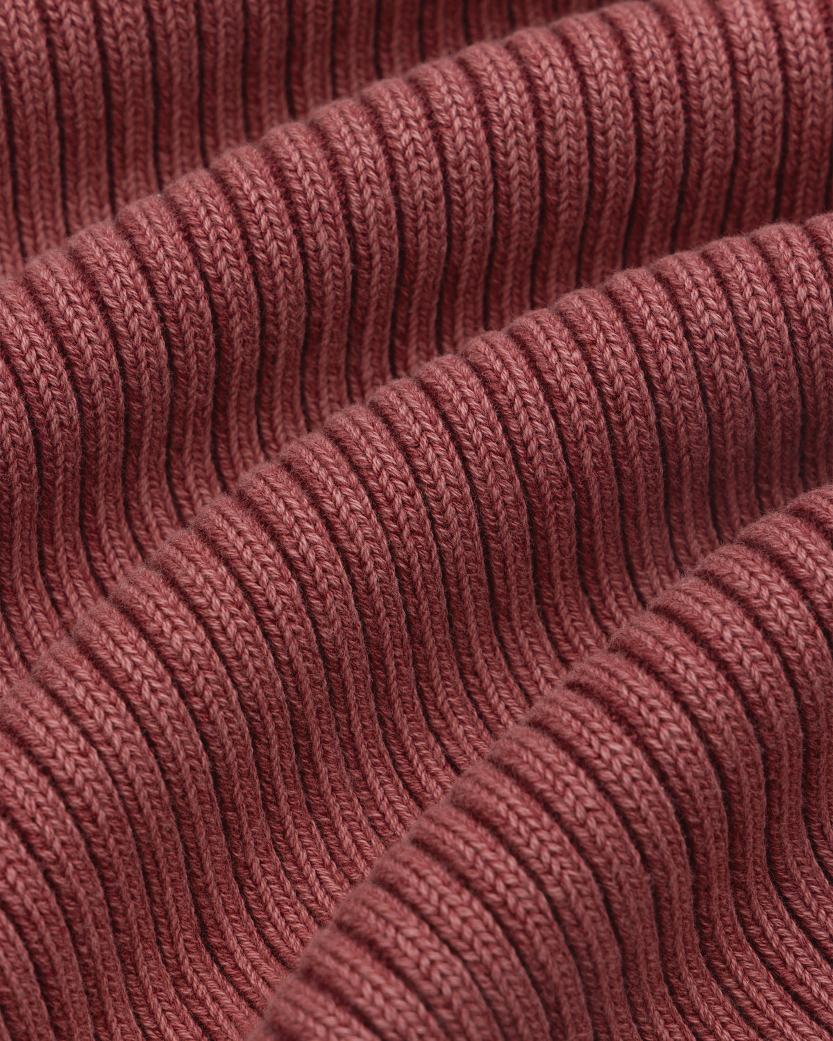 Close-up of textured, ribbed fabric with soft folds on the Stone Washed Knit Tank Top.