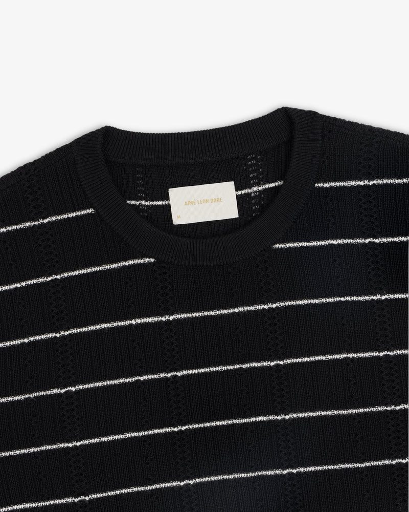 Merino Wool Eyelet Tee with white horizontal stripes and a ribbed crew neckline, shown from above.