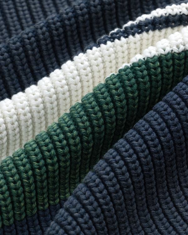 Close-up of Striped Knit Rugby fabric with navy blue, green, and white textured horizontal stripes.