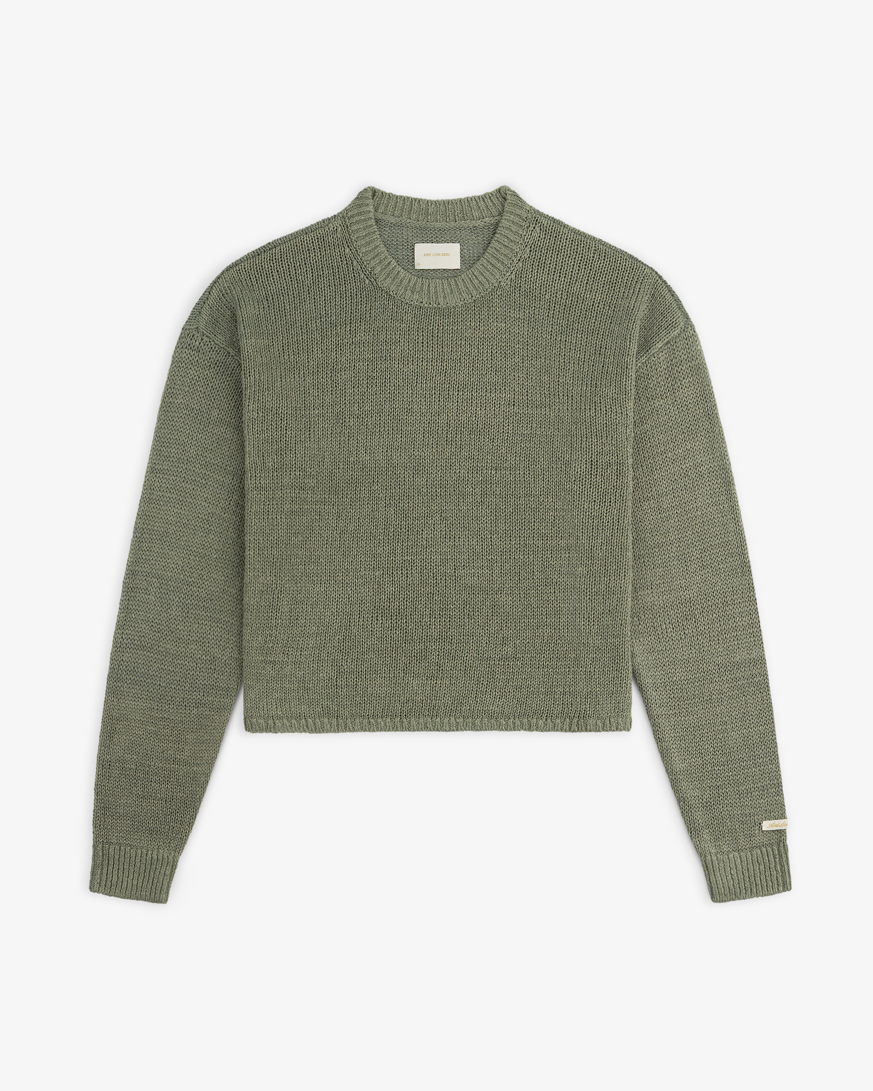 Linen Knit Crewneck Sweater in olive green with long sleeves and ribbed cuffs, shown flat on a white background.