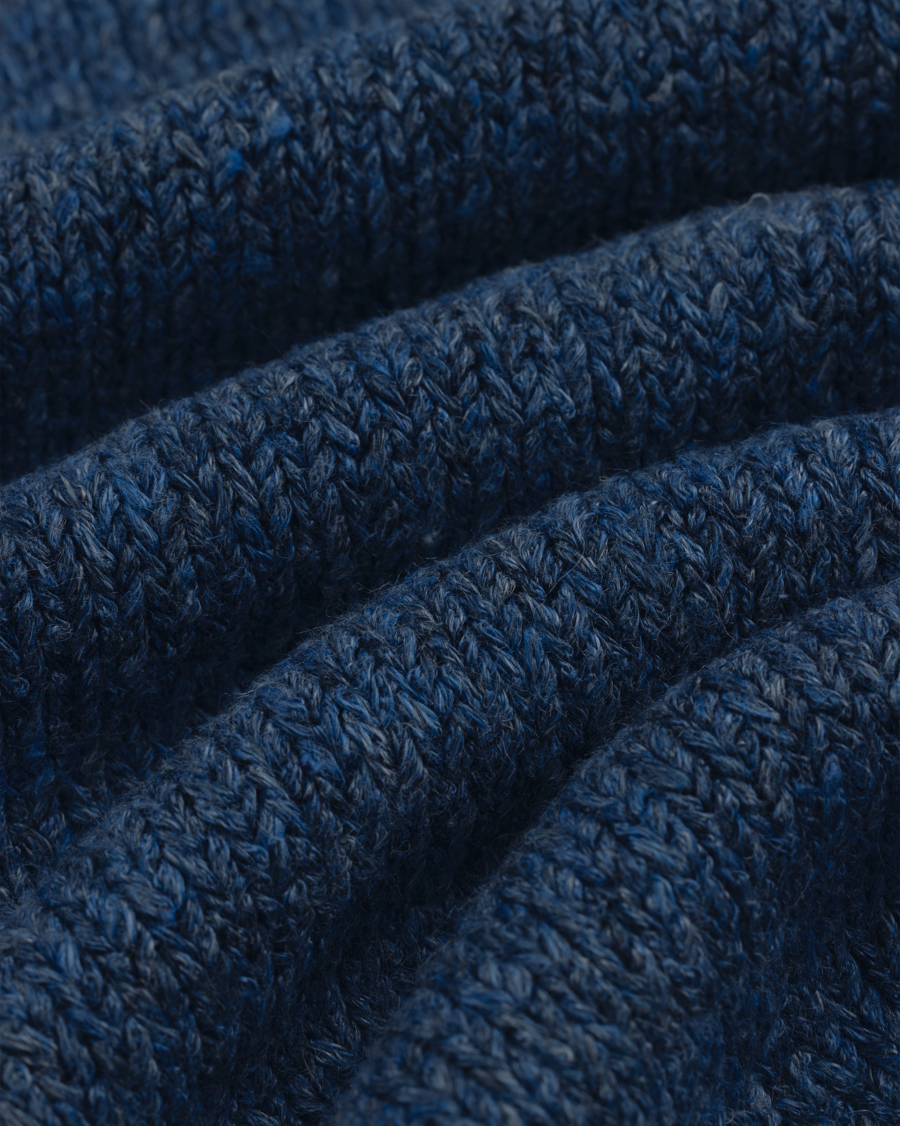 Close-up of textured blue Linen Knit Drawstring Short showing visible rows of stitches and soft folds.