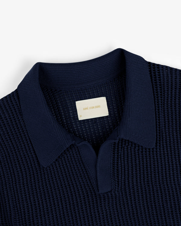 Navy Mesh Knit Polo with a visible label inside the collar.
