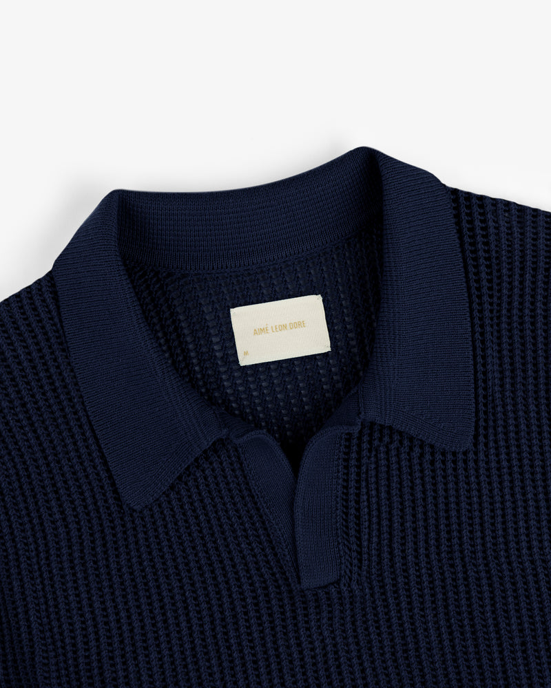 Navy Mesh Knit Polo with a visible label inside the collar.