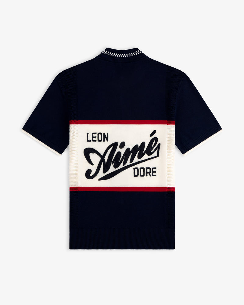 Navy Merino Wool Cycling Jersey with Leon Aimé Dore text on a white and red panel across the back.
