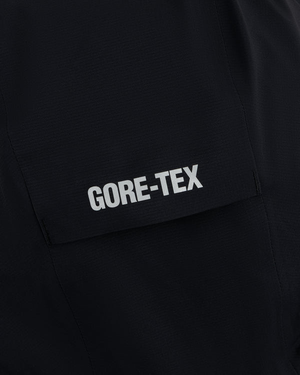 Close-up of the Lightweight GORE-TEX Shell Jacket's black pocket with GORE-TEX printed in white.
