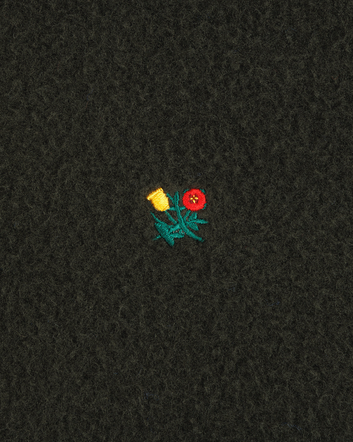 Small yellow and red embroidered flowers with green stems adorn the Casentino Crest Half-Zip Pullover.