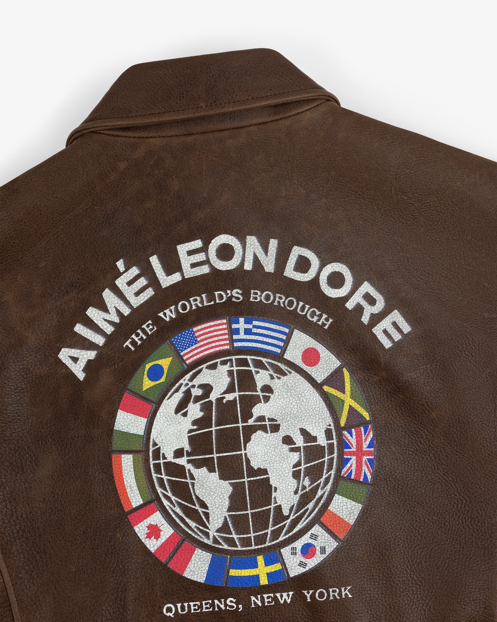 World's Borough Leather Flight Jacket with AIMÉ LEON DORE, globe and flags, text: QUEENS, NEW YORK.