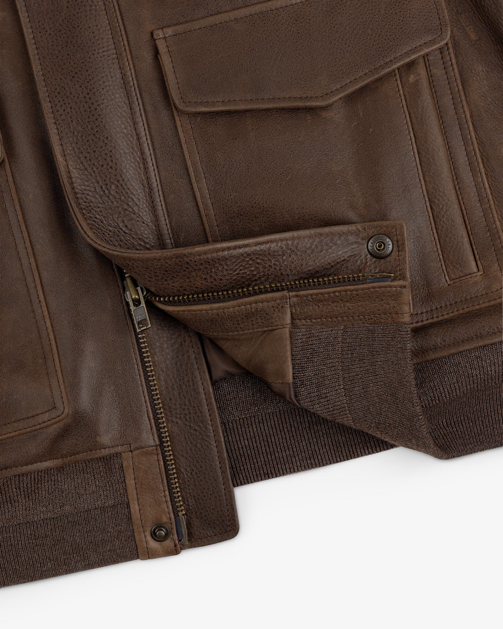 Close-up of the World's Borough Leather Flight Jacket with zippered opening and pocket details.