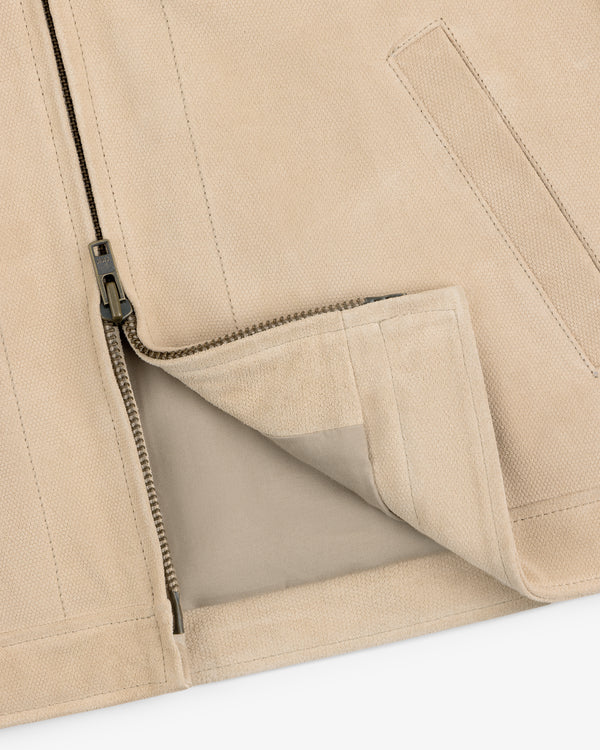 Close-up of the Leather Ranch Jacket featuring a partially unzipped metal zipper and inner lining.