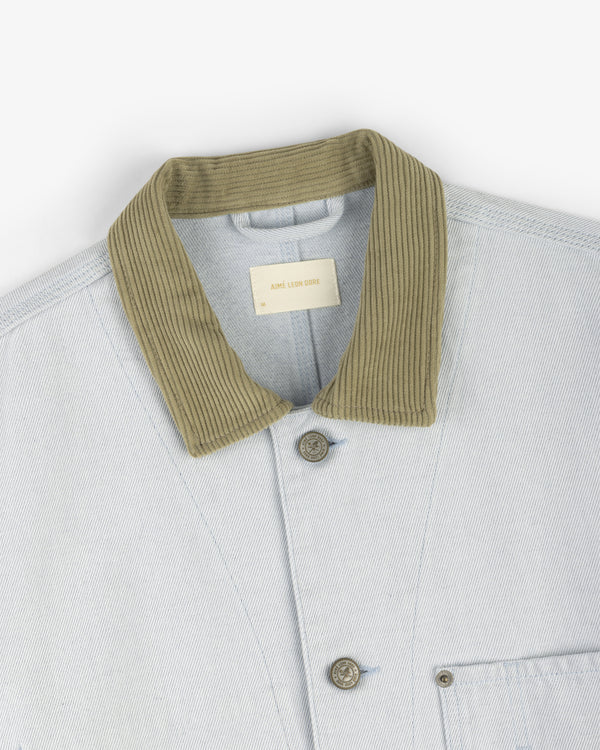 Denim Barn Jacket in light blue with ribbed olive green collar, visible buttons, and a chest pocket.