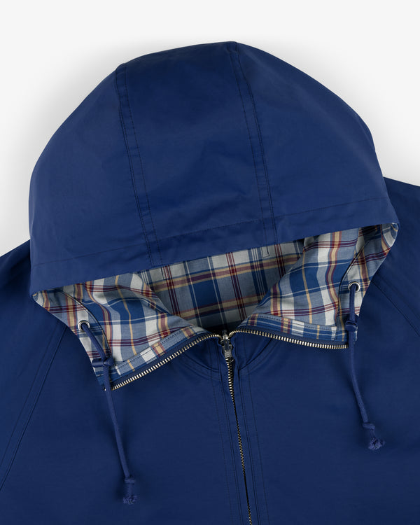 Reversible Madras Windbreaker: blue hooded jacket with zipper, drawstrings, and blue/red plaid lining.