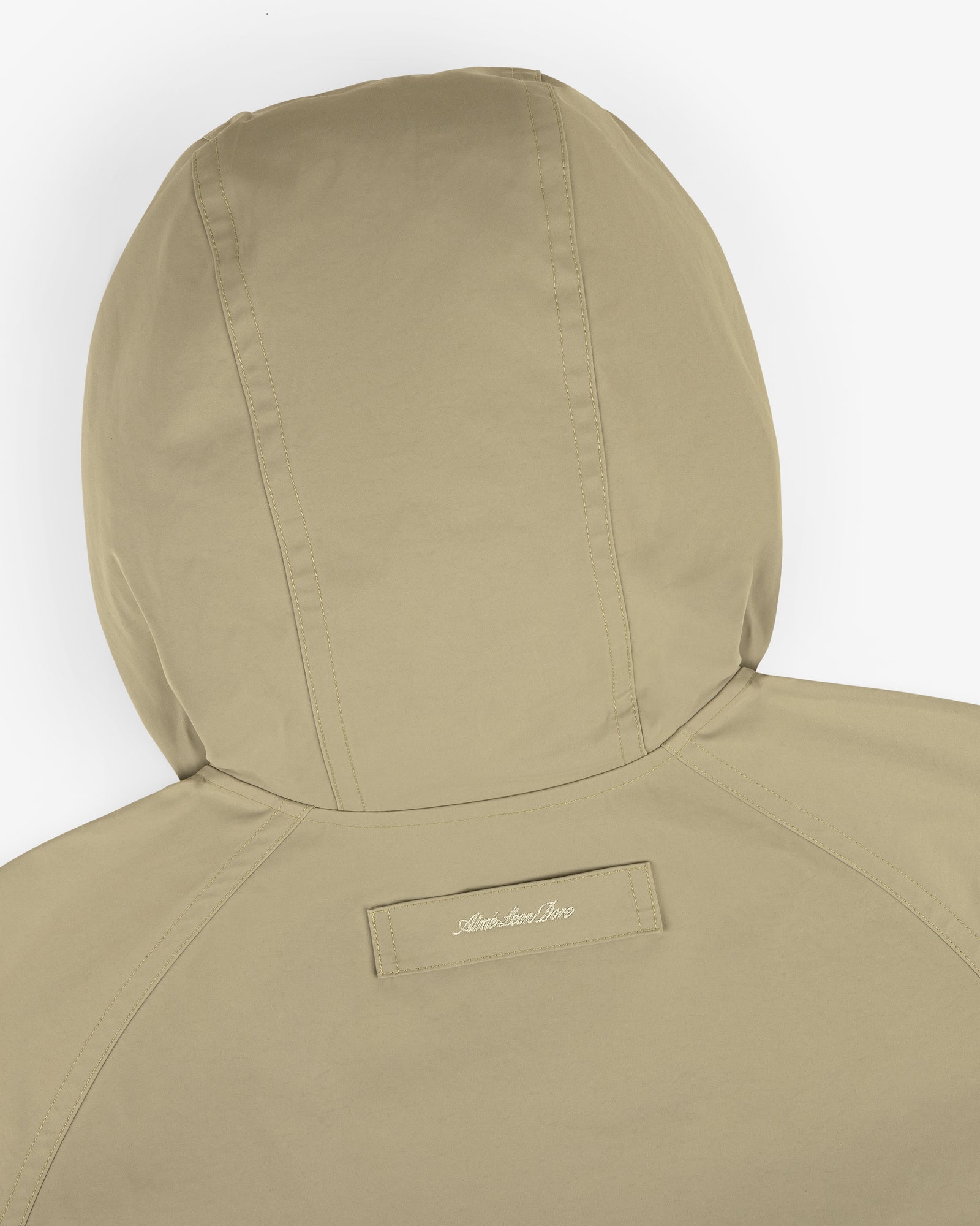 Back view of the Reversible Madras Windbreaker in khaki, with a small embroidered patch near the center.