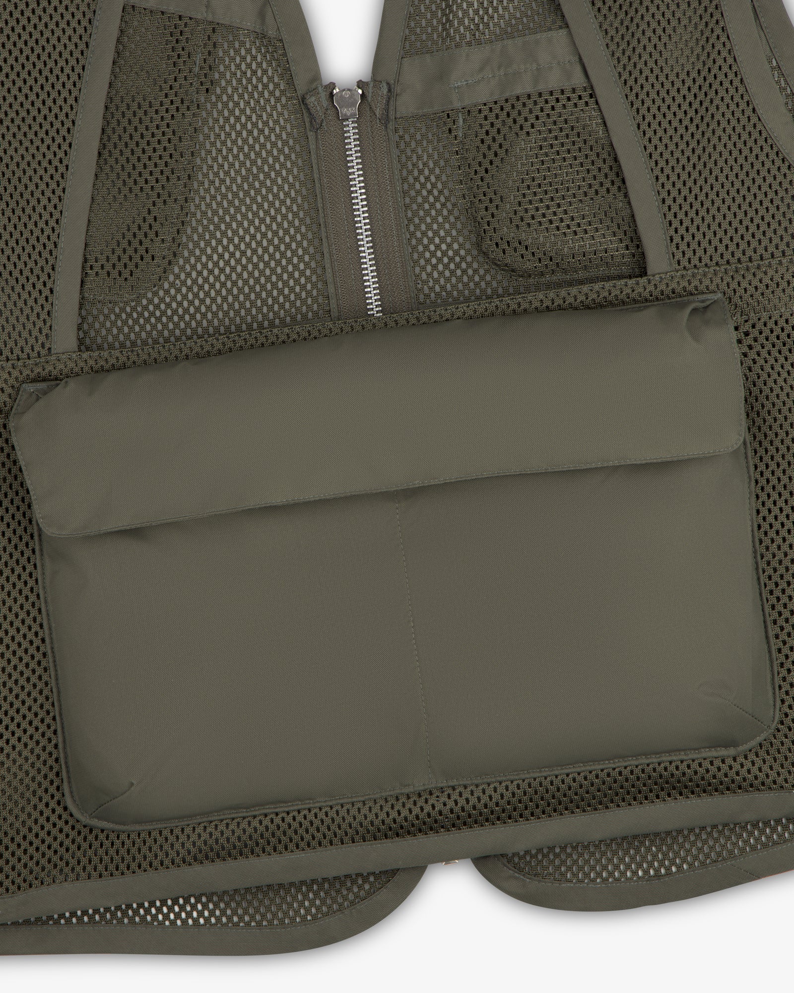 Close-up of the Nylon Utility Vest featuring a large rectangular padded front pocket.