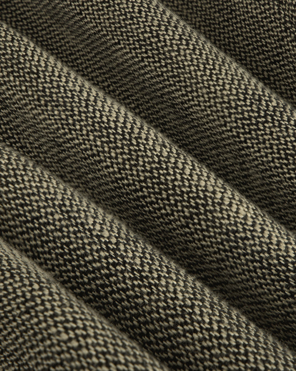 Close-up of the Single-Breasted Yarn Dyed Linen Suit Jacket's ribbed, textured woven fabric with raised and flat sections.