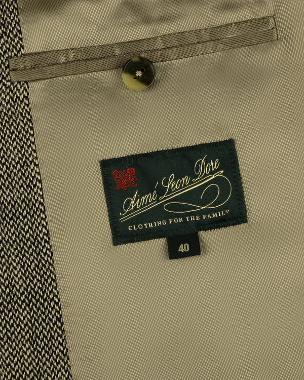 Close-up of Single-Breasted Yarn Dyed Linen Suit Jacket interior with pocket, button, and size 40 Aimé Leon Dore label.
