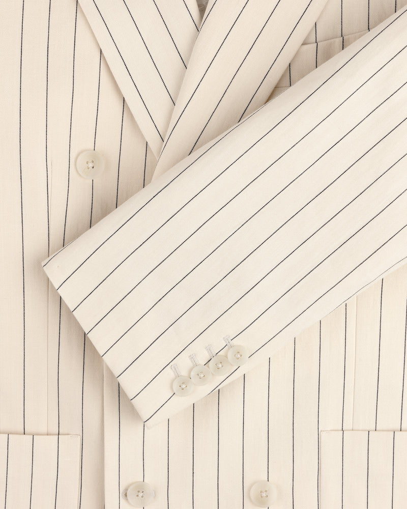 Close-up detail of the Double-Breasted Pinstripe Suit Jacket in cream with white buttons and notched lapel.