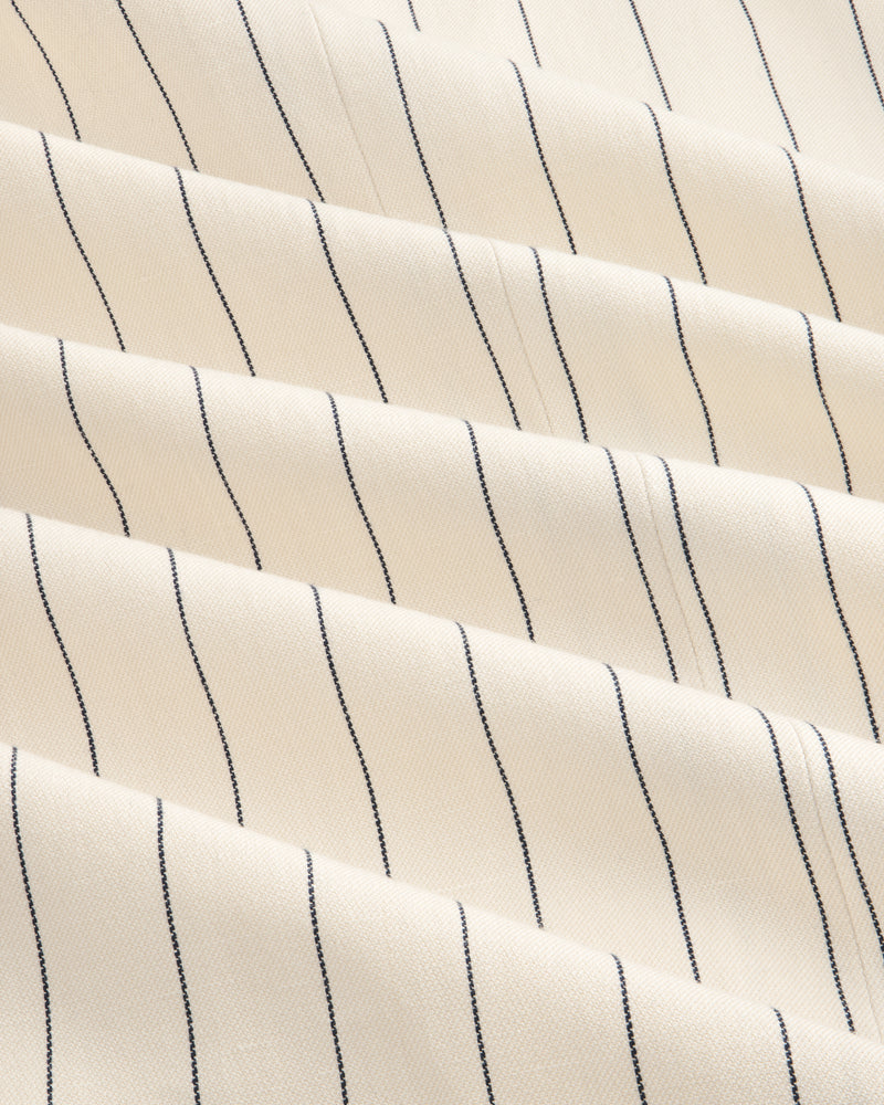 Cream-colored Double-Breasted Pinstripe Suit Jacket with thin black stripes and a subtly textured surface.