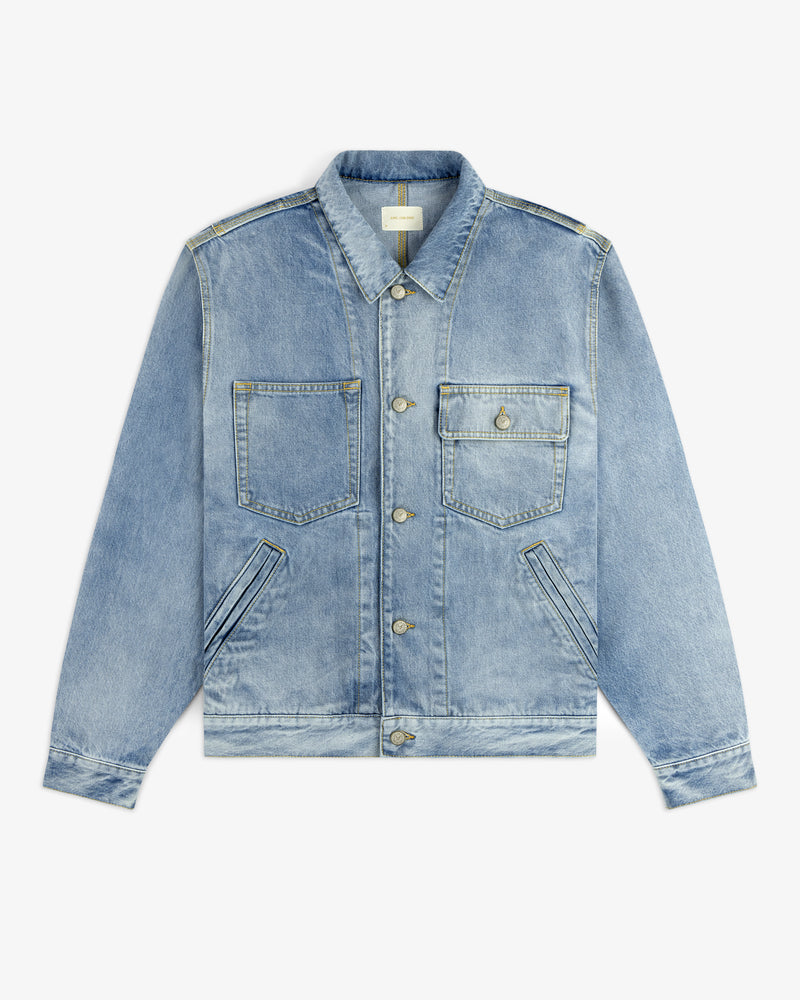 Denim Trucker Jacket in light blue with buttons, two chest pockets, and two slanted side pockets on white background.