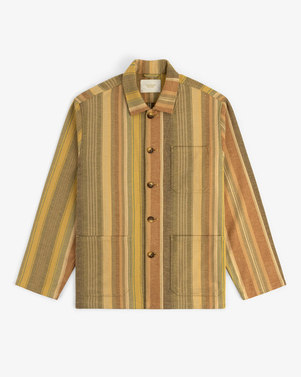 Blanket Striped Chore Jacket with vertical yellow, brown, and beige stripes, long sleeves, and three front pockets.