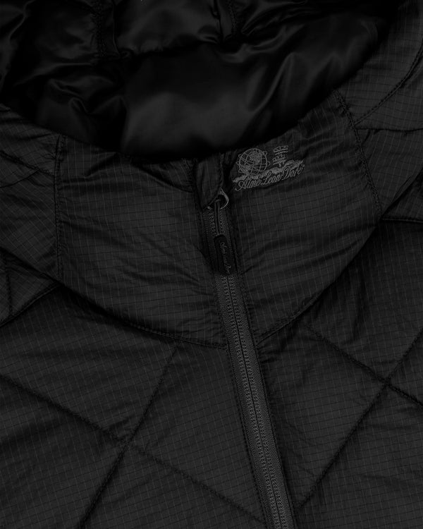 Close-up of the Nylon Quilted Unisphere Jacket in black with a visible zipper and subtle grid pattern.