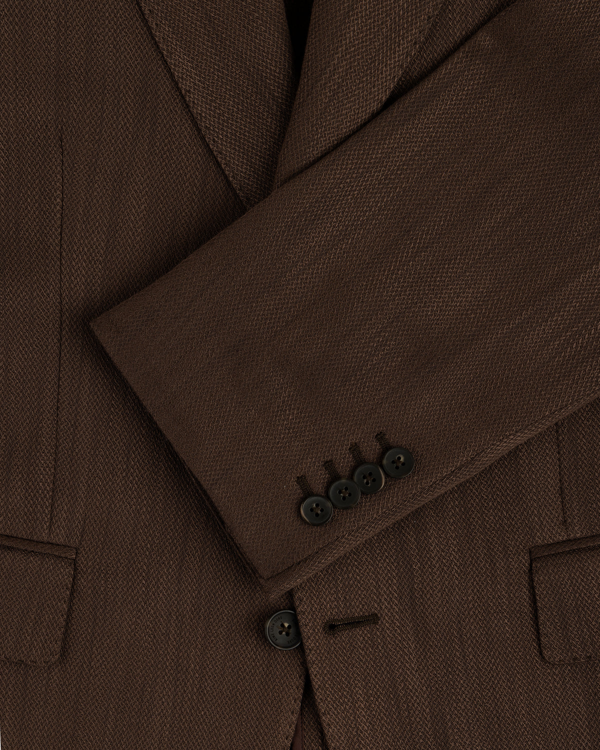 Close-up of a Single-Breasted Linen Blend Suit Jacket sleeve, featuring four black buttons and a visible pocket.