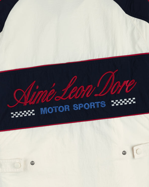 Nylon Moto Jacket: white with red Aimé Leon Dore script, blue Motor Sports, and checkered designs.