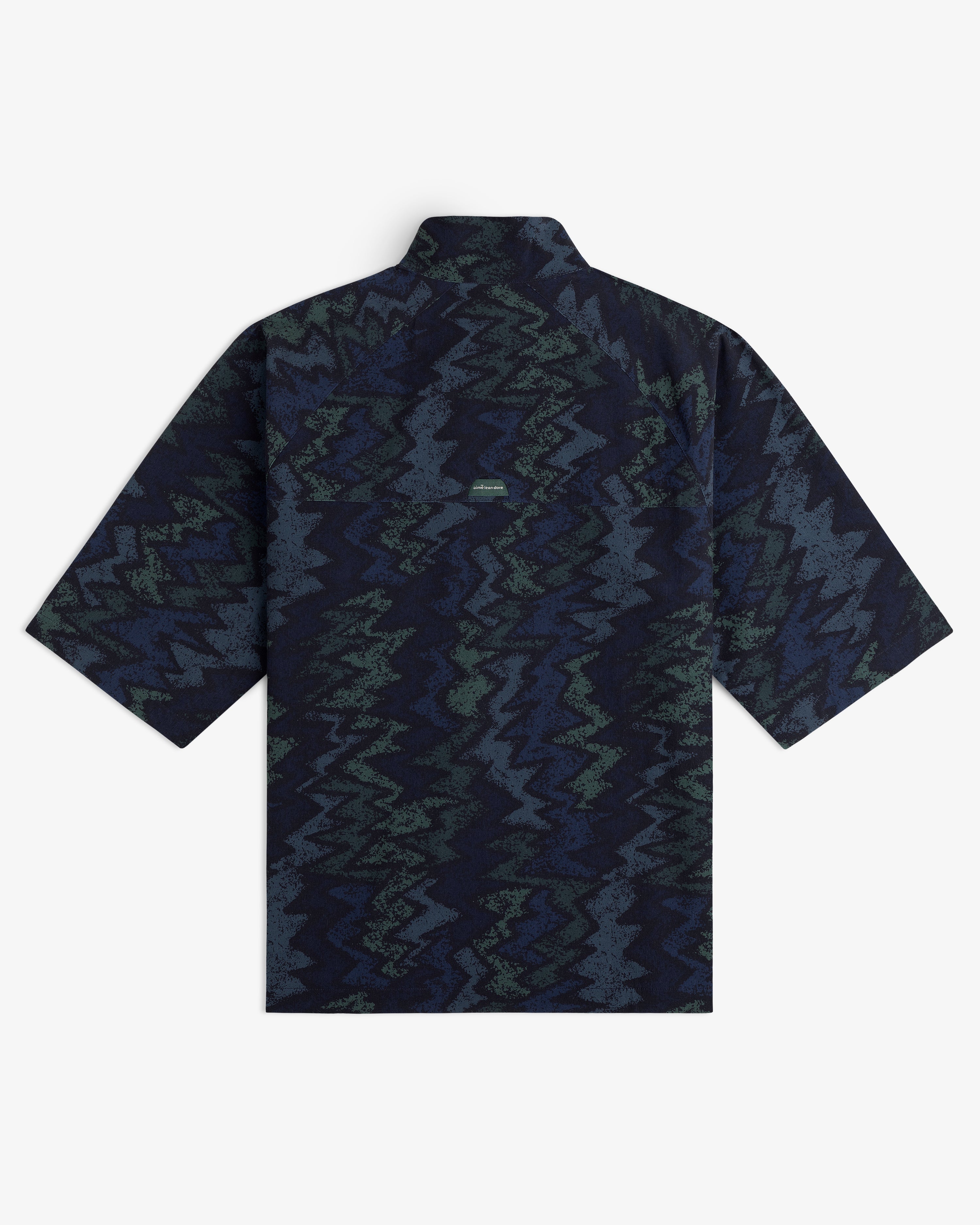 ALD Golf Nylon Quarter Zip Pullover with a dark blue and green zigzag pattern, shown from the back.
