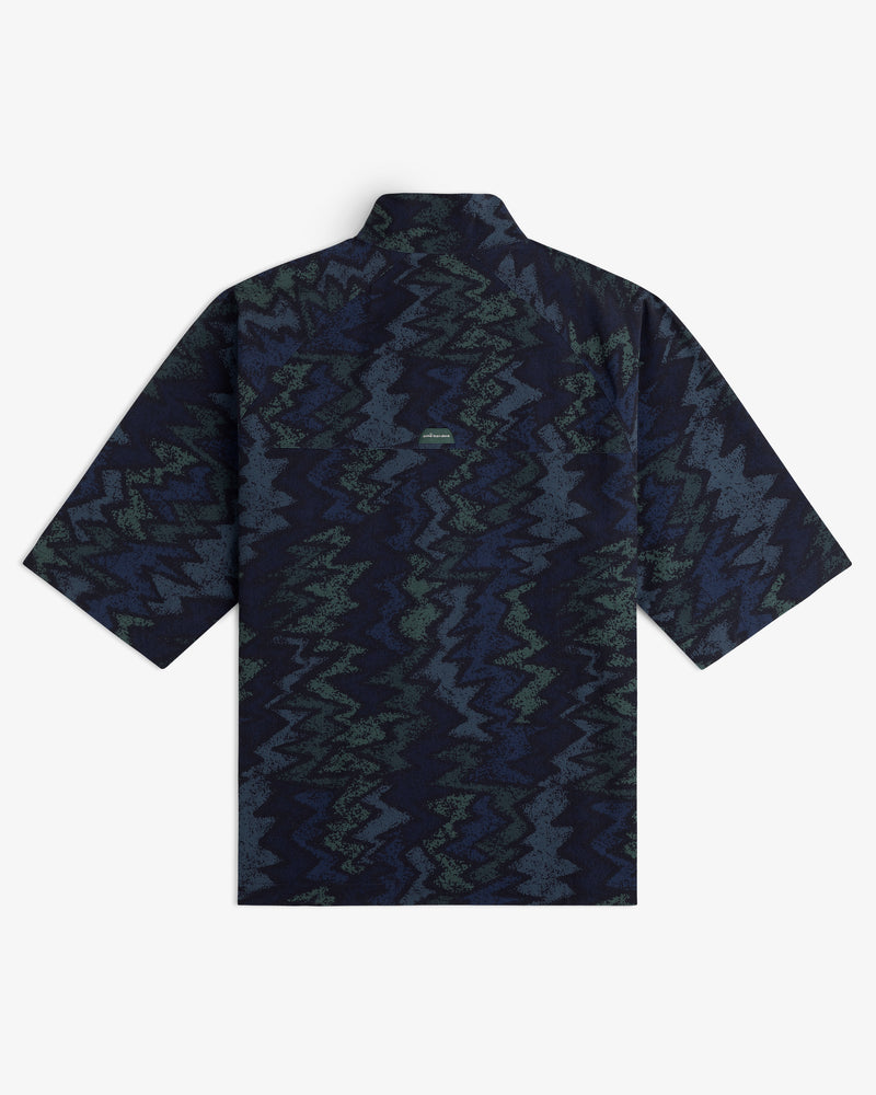 ALD Golf Nylon Quarter Zip Pullover with a dark blue and green zigzag pattern, shown from the back.