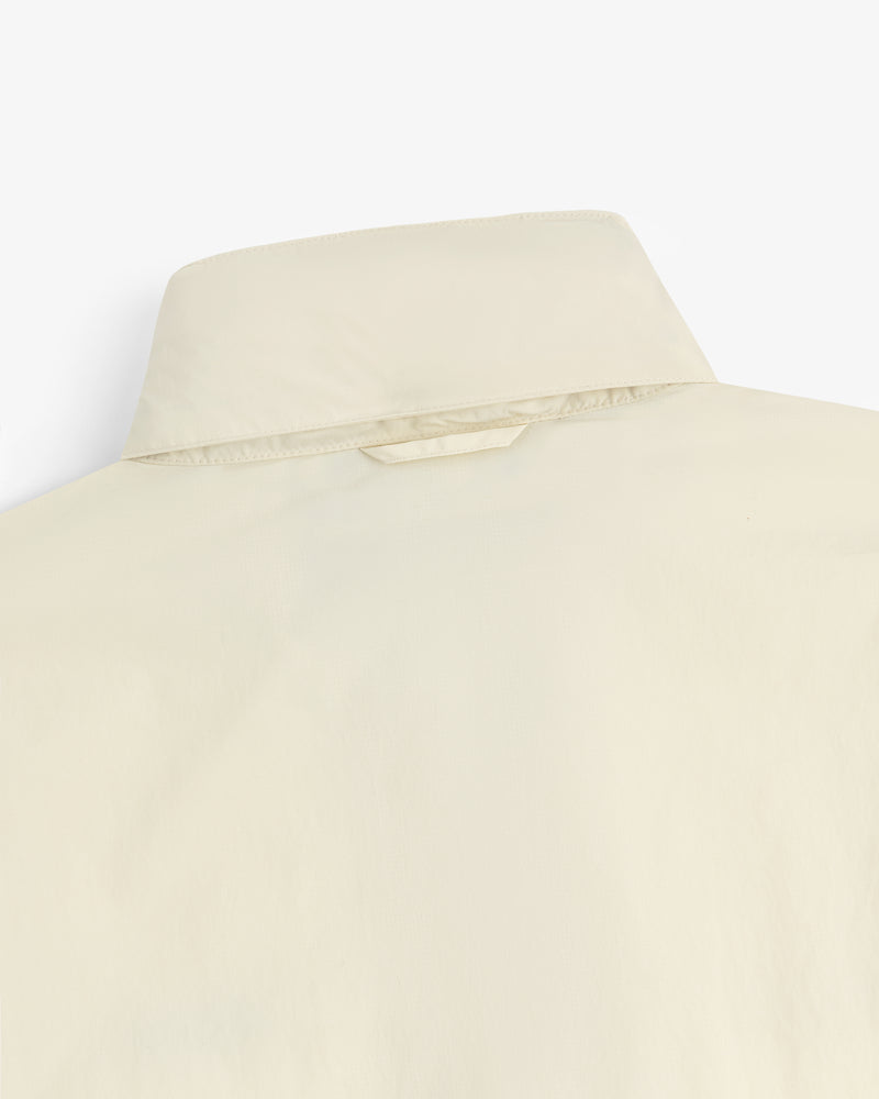 Close-up of the back of a Nylon Track Jacket, showing the collar and a small fabric loop below it.