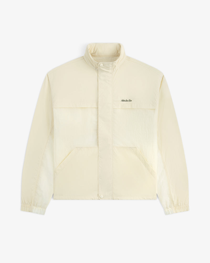 Light beige Nylon Track Jacket with long sleeves, snap buttons, front pockets, elastic cuffs, and left chest logo.