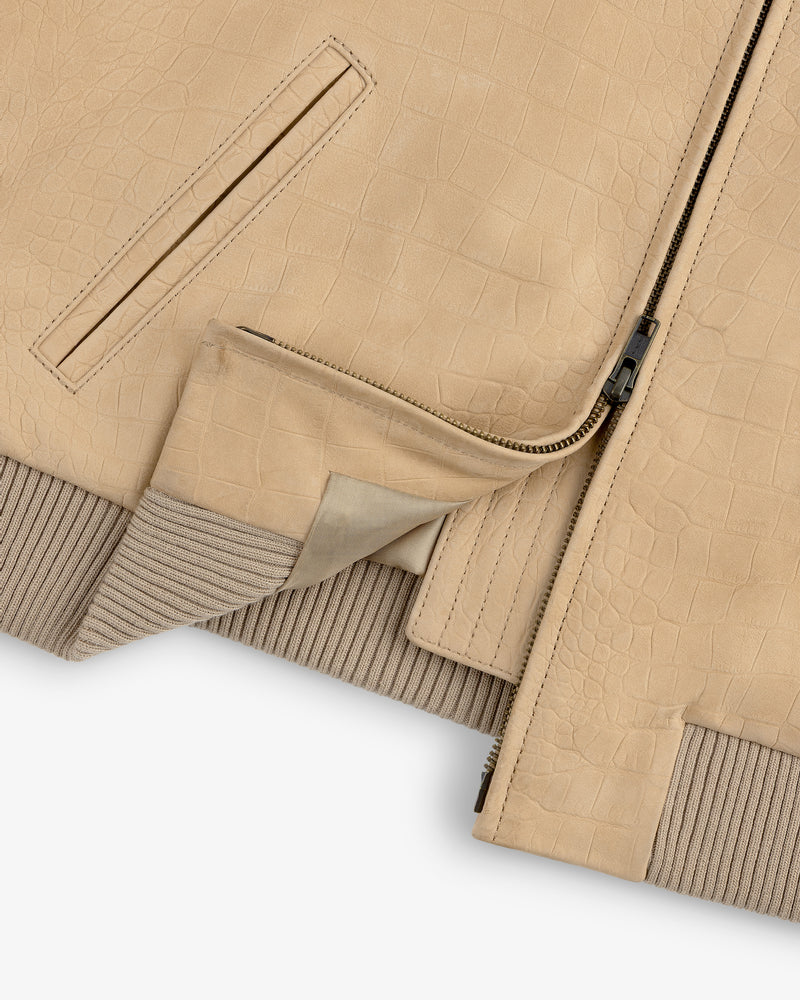 Close-up of the Croc-Embossed Nubuck Bomber Jacket with zipper, ribbed knit hem, and pocket details.