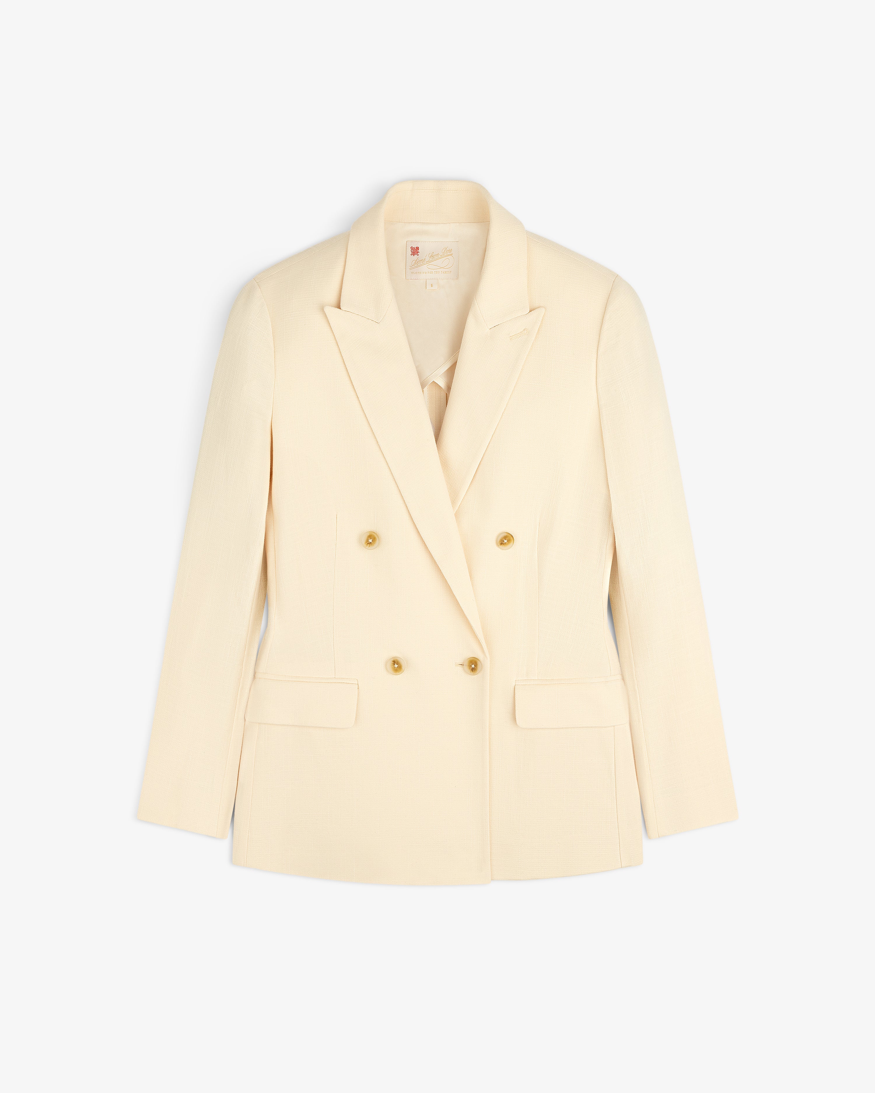 Double-Breasted Unconstructed Blazer in cream with gold buttons and flap pockets, shown on a white background.