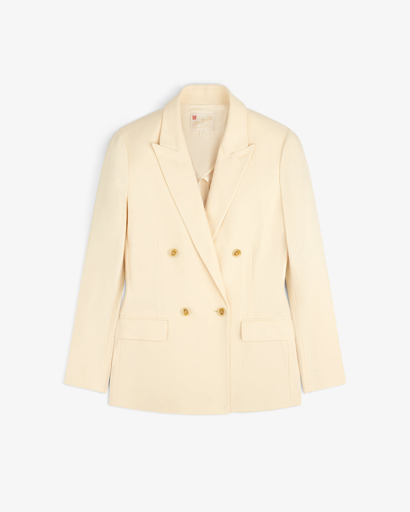 Double-Breasted Unconstructed Blazer in cream with gold buttons and flap pockets, shown on a white background.