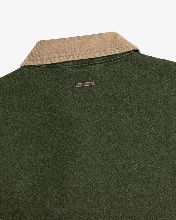 Close-up of the back of the Denim Zip Jacket featuring a beige corduroy collar and metal nameplate below it.