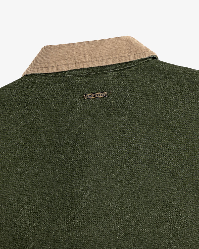 Close-up of the back of the Denim Zip Jacket featuring a beige corduroy collar and metal nameplate below it.