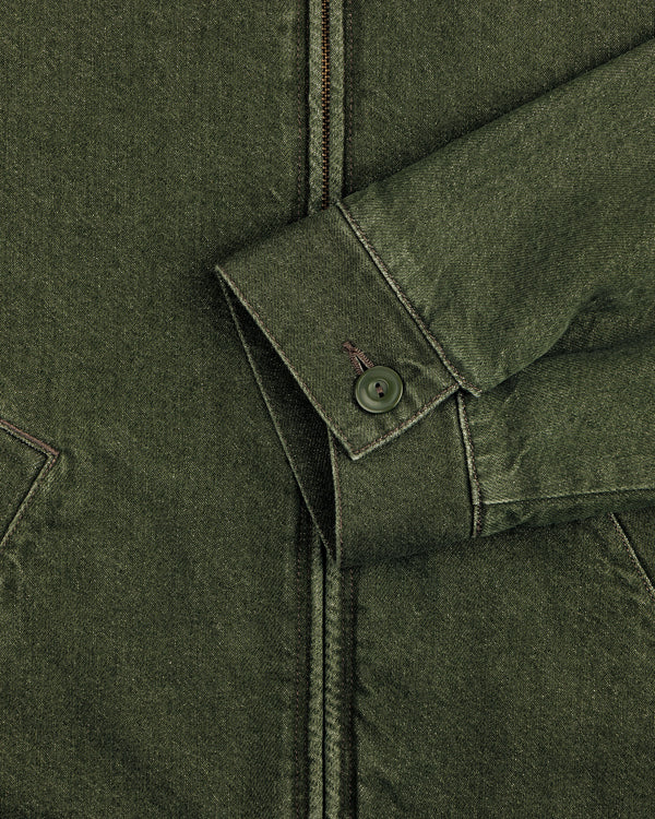 Close-up of a green Denim Zip Jacket sleeve with a buttoned cuff and visible stitching against the jacket’s body.