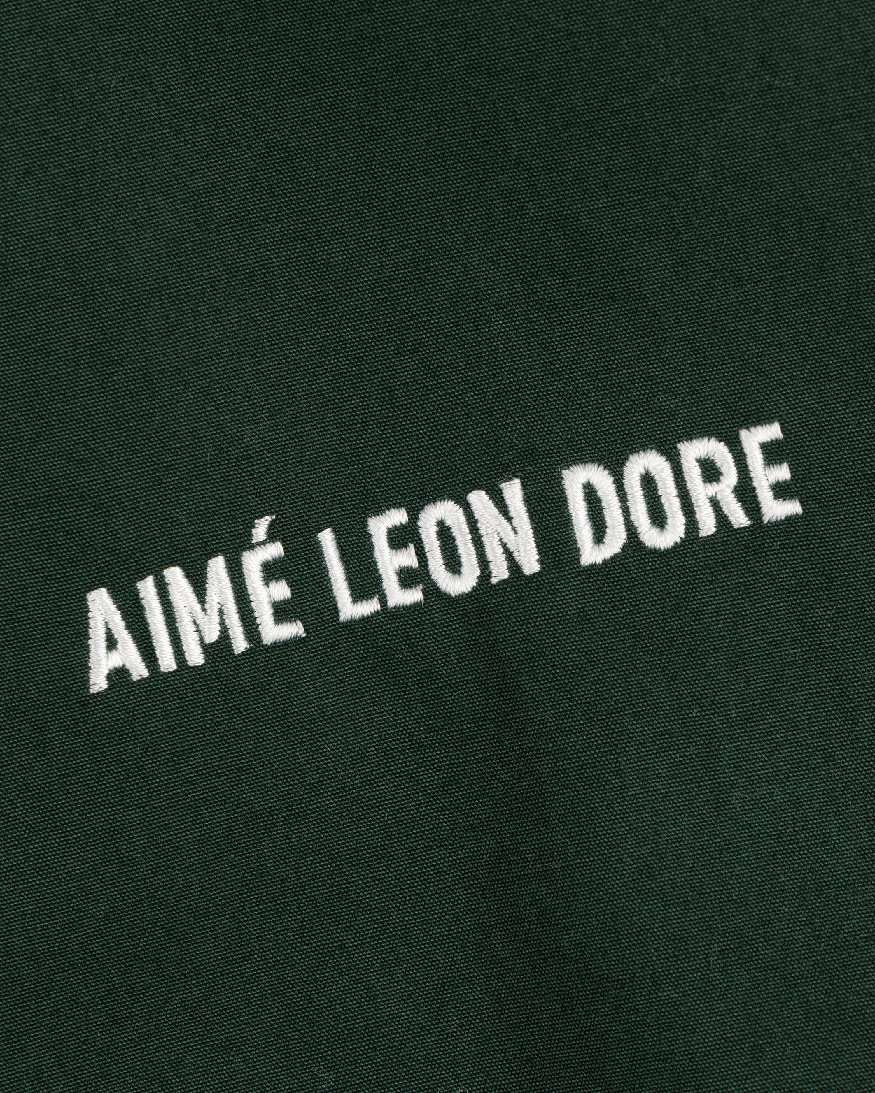 Green Micro Logo Lightweight Jacket with AIMÉ LEON DORE embroidered in white, all uppercase letters.