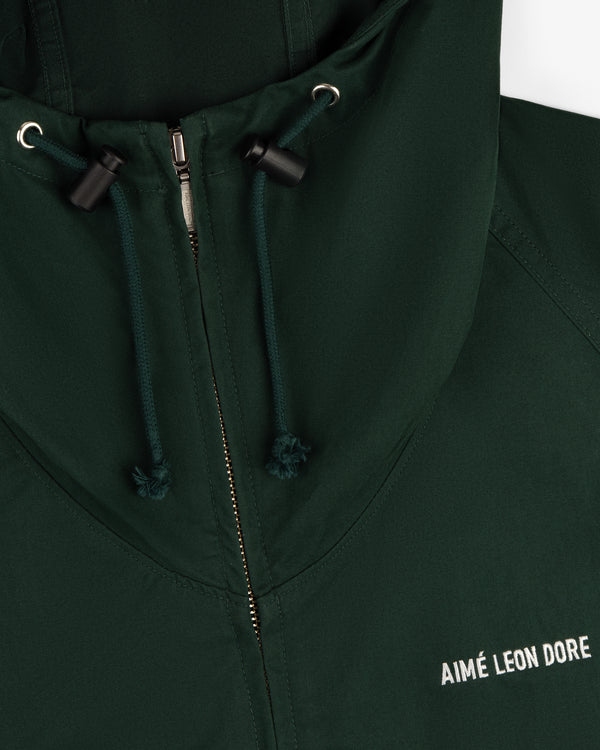 Dark green Micro Logo Lightweight Jacket with zipper, hood drawstrings, and white AIMÉ LEON DORE embroidery.