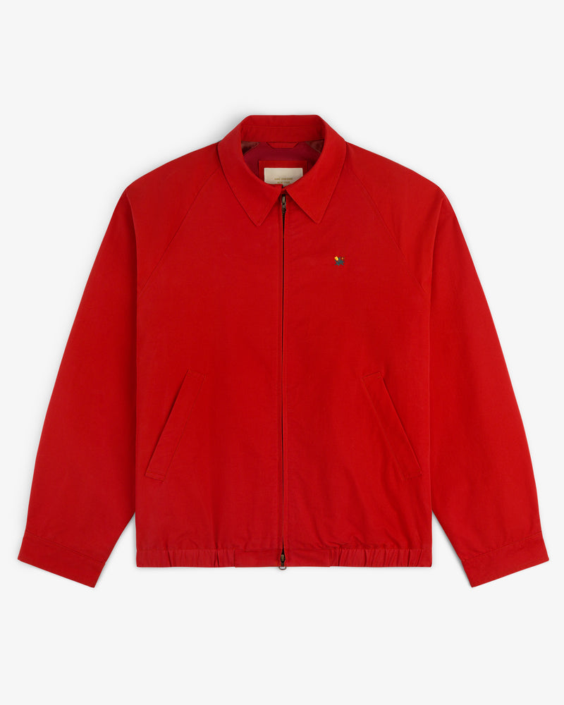 Crest Casual Jacket: bright red zip-up with collar, angled pockets, and small emblem on left chest.