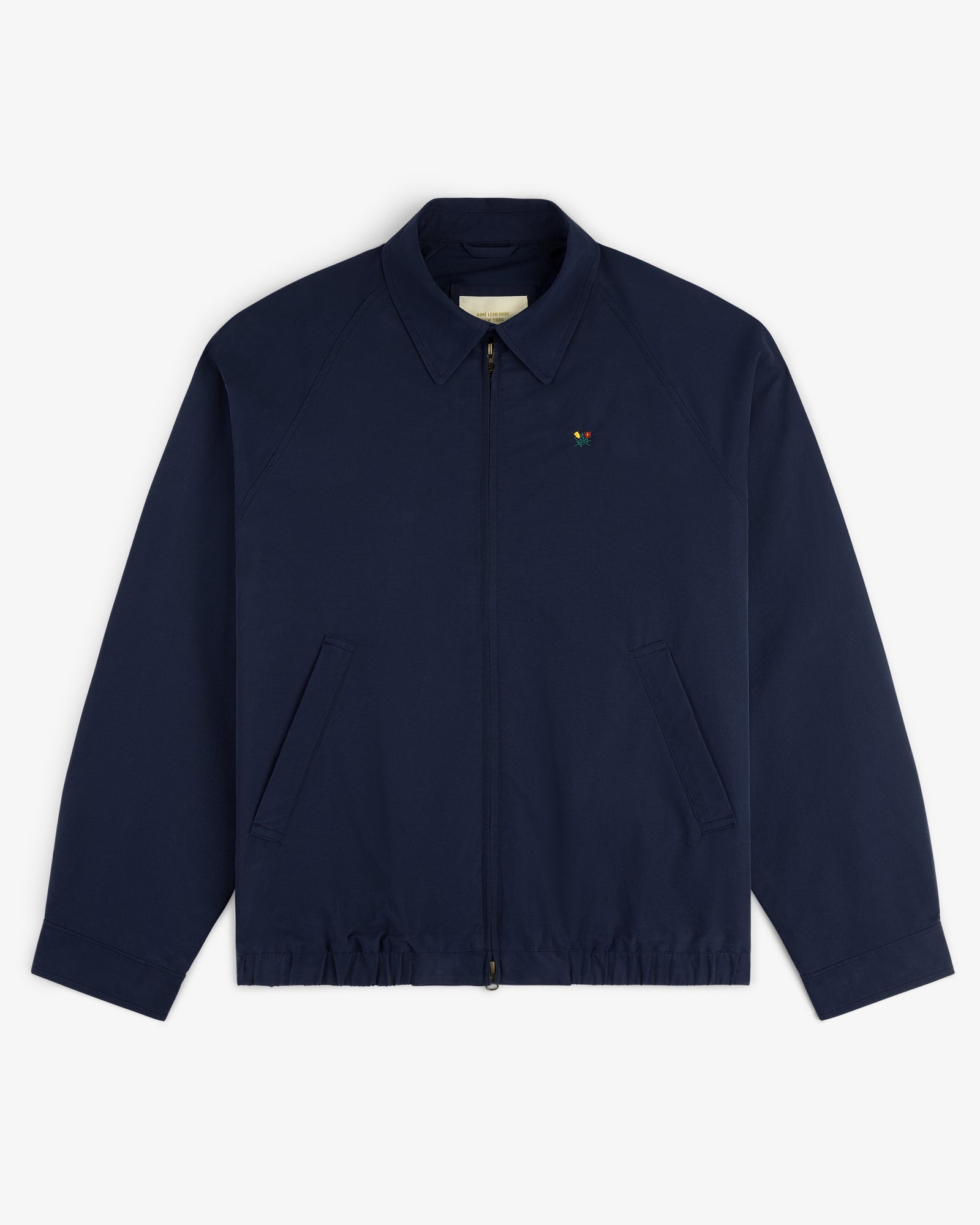 Crest Casual Jacket: navy blue zip-up with collar, slanted front pockets, and a small chest embroidered logo.