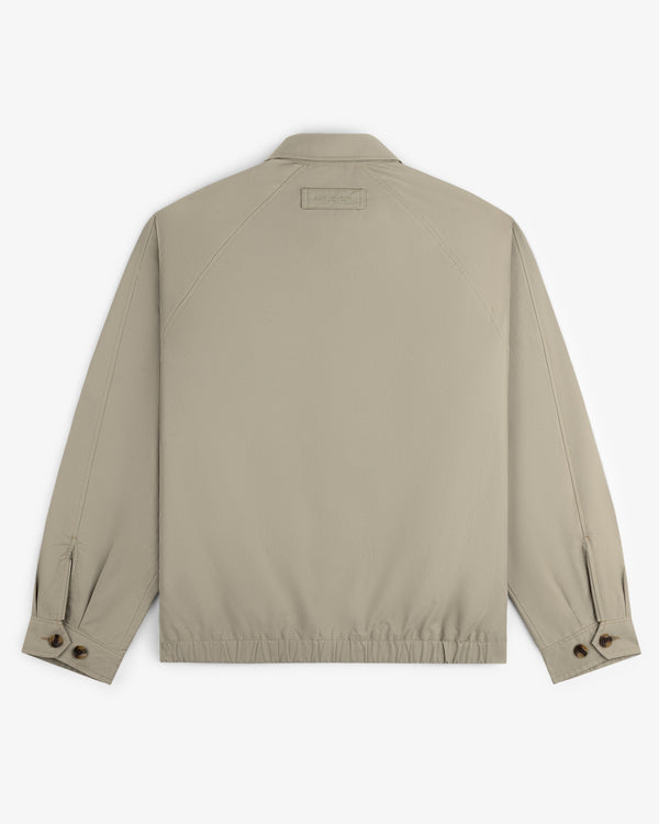 Crest Casual Jacket in beige shown from the back with collar, buttoned cuffs, and elastic waistband.