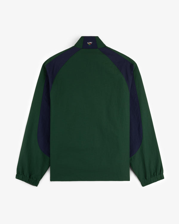 Back view of the Crest Nylon Half-Zip Pullover in dark green with navy shoulder and side panels.