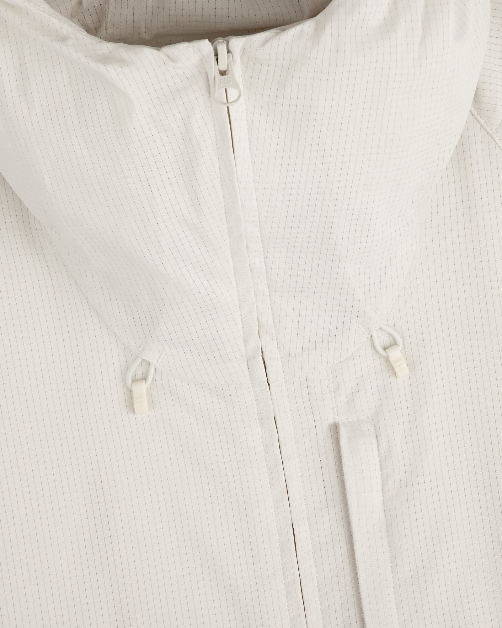 Close-up of the ALD Golf Lightweight Tips Windbreaker in white with high collar, front zipper, and drawstring toggles.