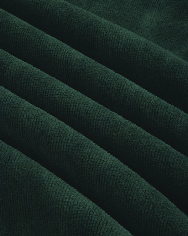 Close-up of the Mulberry Robe's dark green corduroy, showing its soft, textured surface and raised ridges.