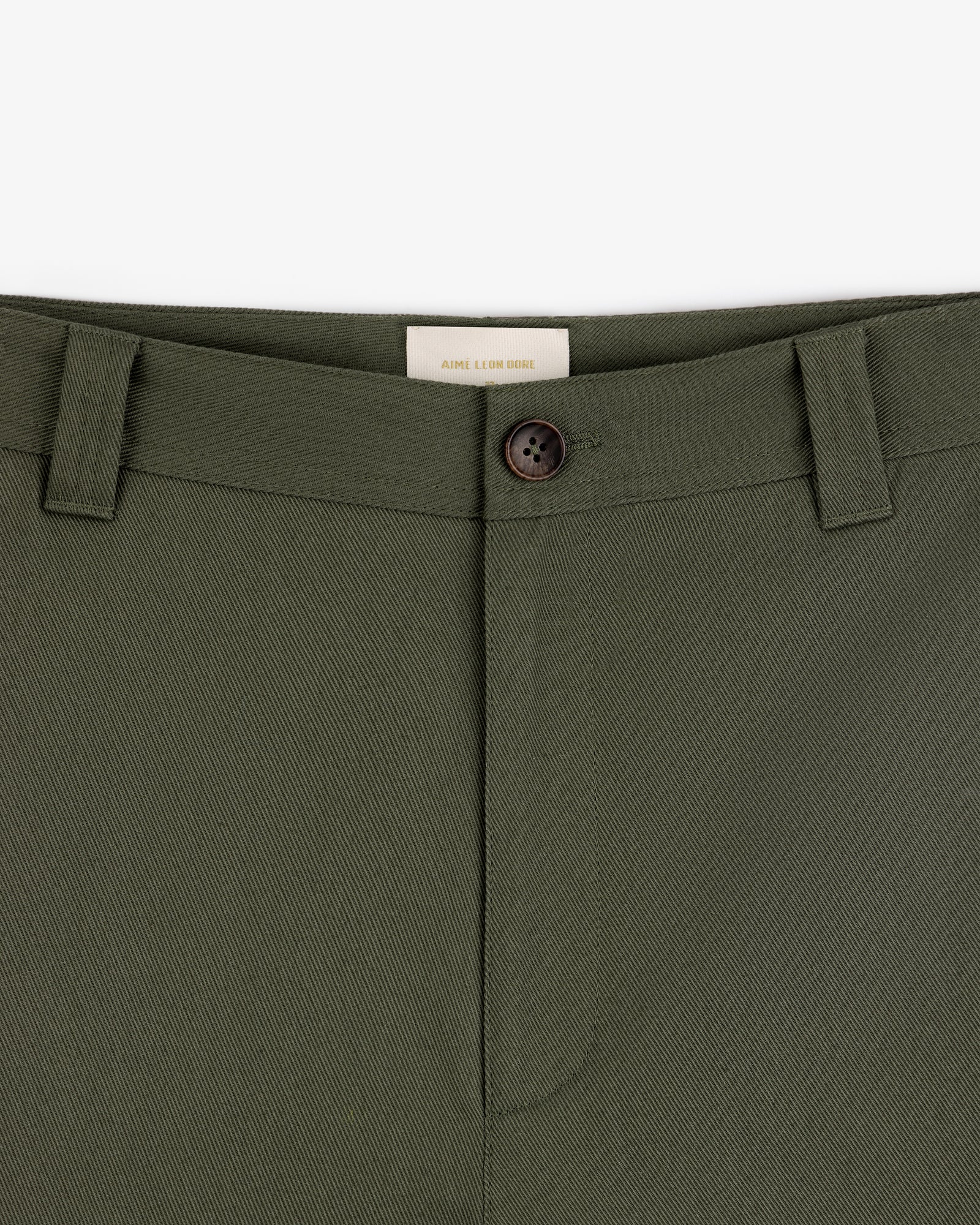 Close-up of Officer Pant in olive green with belt loops, button closure, and a visible waistband label on white background.