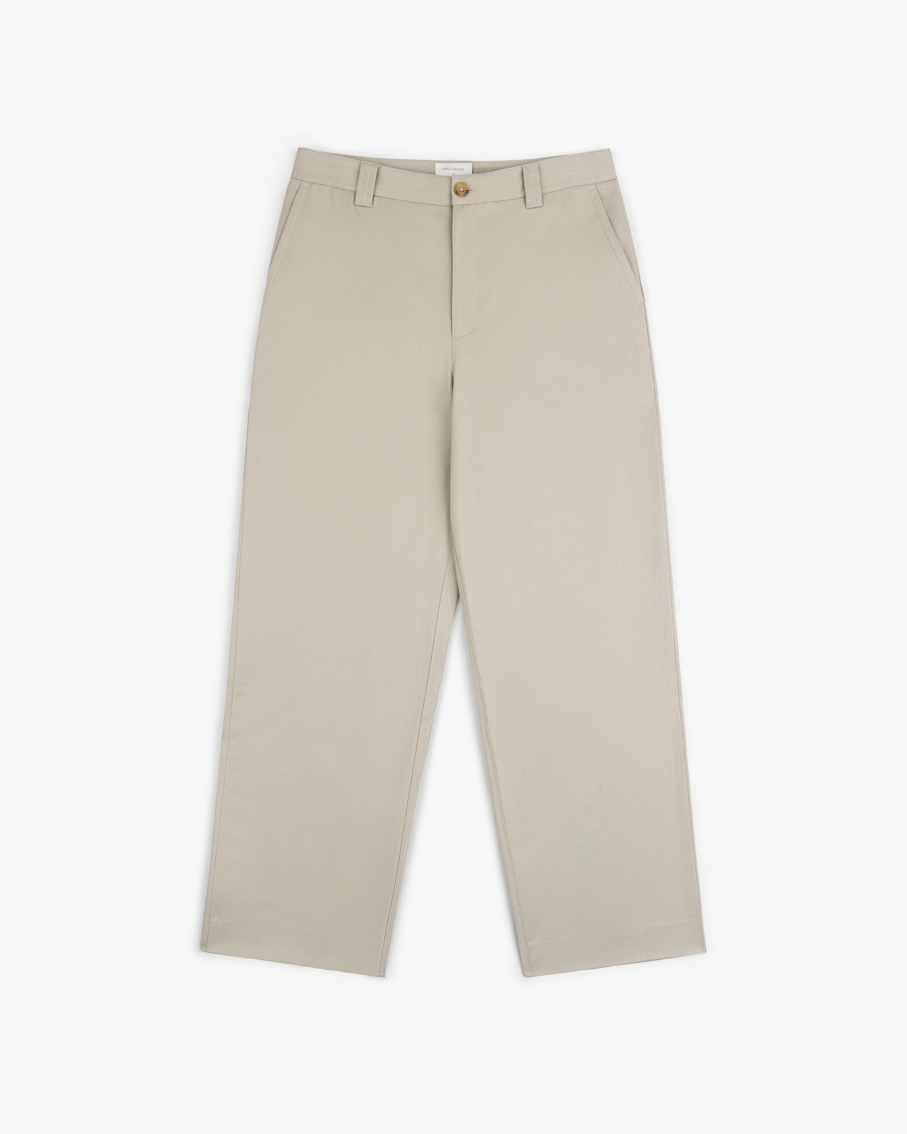 Officer Pant in beige, featuring straight legs, side pockets, belt loops, and button closure, shown on white.
