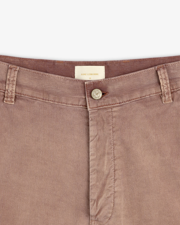 Close-up of Linen Blend Carpenter Pant in mauve-brown with button closure, belt loops, and Aimé Leon Dore label.