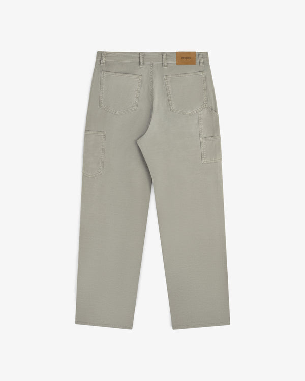 Light gray Linen Blend Carpenter Pant with back pockets and tan leather waistband patch, shown from the back.