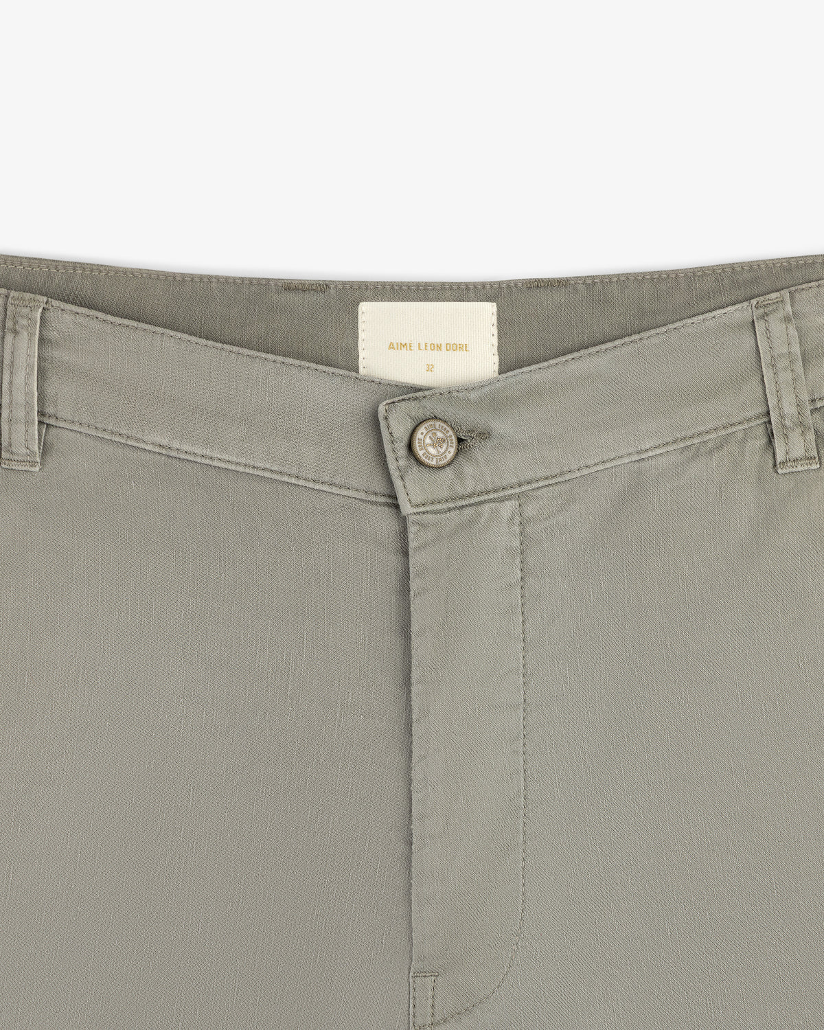 Close-up of the waistband and button on Linen Blend Carpenter Pant, with belt loops and a small inside brand label.