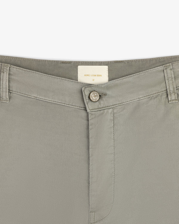 Close-up of the waistband and button on Linen Blend Carpenter Pant, with belt loops and a small inside brand label.